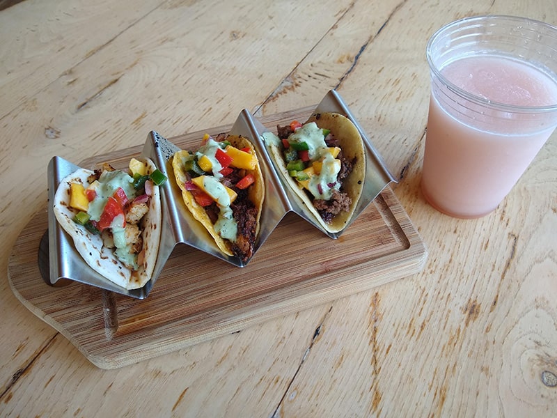 Image of tacos and a wine slushie served at Flying Otter.