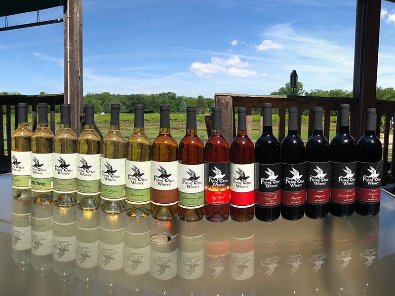 Image of various white and red wines by Flying Otter Winery.